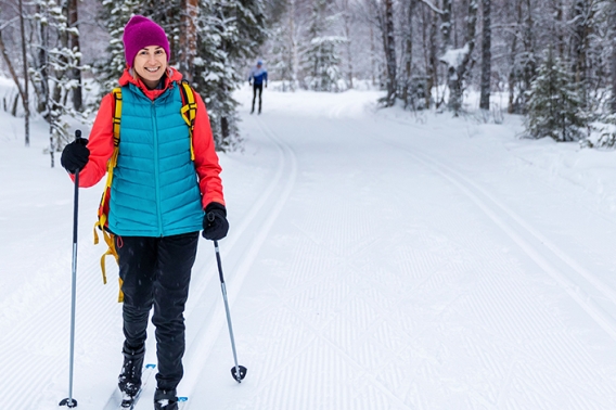 Woman cross country skiing in the winter.