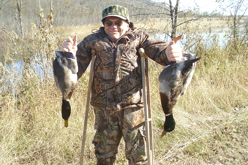 DAC menber John Mitchell holding 2 ducks after successful hunt