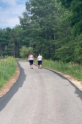 People walking along Lapham Peaks' Plantation Trail in the Kettle Moraine State Forest.
