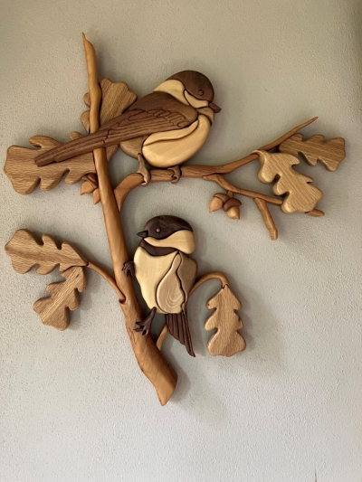 An image of a Chickadee wood art piece with two Chickadees on a tree branch.