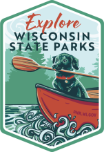 Dog in canoe with paddle labeled Explore Wisconsin State Parks.