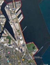 A map showing a example of man-made upland shorelines by City of Milwaukee Jones Island within Milwaukee County using a red link to indicate the boundary.