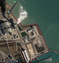 A map showing a example of man-made upland shorelines by City of Milwaukee WE Energies Fishing Pier and power plant within Milwaukee County using a red link to indicate the boundary.