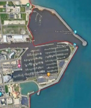 A map showing a example of man-made upland shorelines by Sheboygan Harbor within Sheboygan County using a red link to indicate the boundary.
