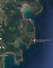 A map showing a example of irregular mainland shorelines in North Bay to Baileys Harbor within Door County using a red link to indicate the boundary.