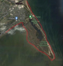 A map showing a example of irregular mainland shorelines in Red Arrow Park and Seagull Bar State Natural Area within Marinette County using a red link to indicate the boundary.