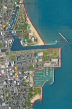A map showing a example of man-made upland shorelines on Simmons Island and marina within Kenosha County using a red link to indicate the boundary.