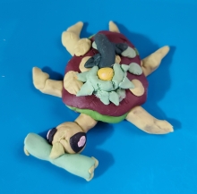 An image of a baby turtle 3D clay project. 