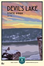 Winter sunset over bluffs and lake labeled Devil’s Lake State Park Est. 1911.
