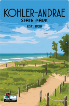 Trails along the lake beach with cloudy blue sky labeled Kohler-Andrae State Park Est. 1928