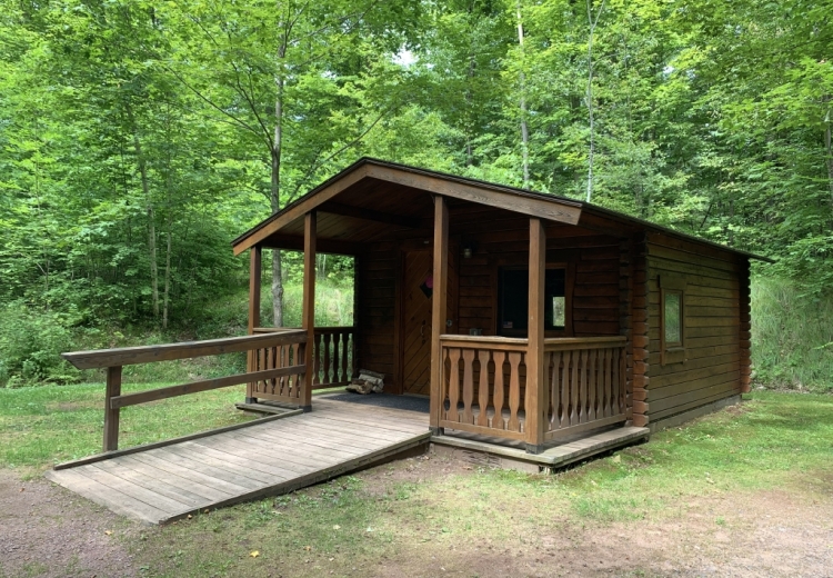 Rustic Accessible Cabin nestled in the campground at Copper Falls State Park.