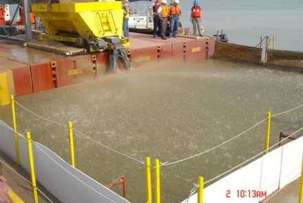 A sand spreader in action on the Fox River.