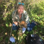 Katie Luukkonen, former assistant project coordinator, holding a fawn