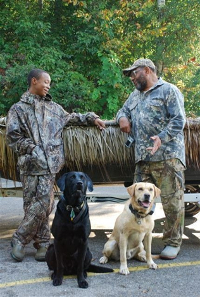 Hunters with their dogs