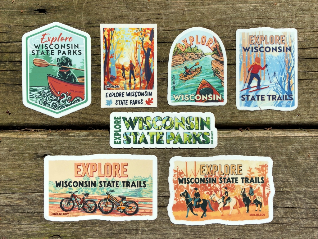 Sticker art on a wooden table showing Wisconsin outdoor recreation.