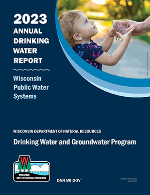 2023 Annual Drinking Water Report Cover showing a young child receiving a glass of water from an adult.