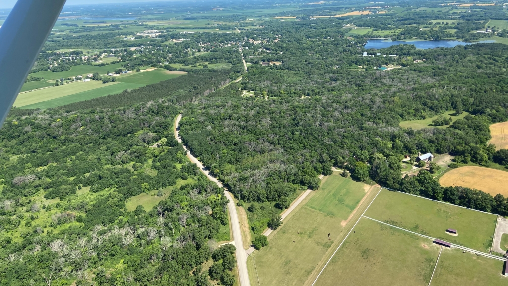 An aerial photograph of a forested landscape.