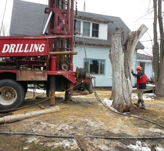DNR Staff overseeing private well install