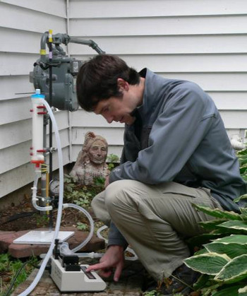 Dr. Sam Sibley, UW-Madison Department of Soil Science, collects a well water sample from a residential home to analyze using new MST tools.