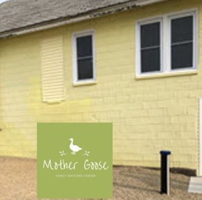 The outside of Mother Goose Child Care Center with the well showing in the foreground