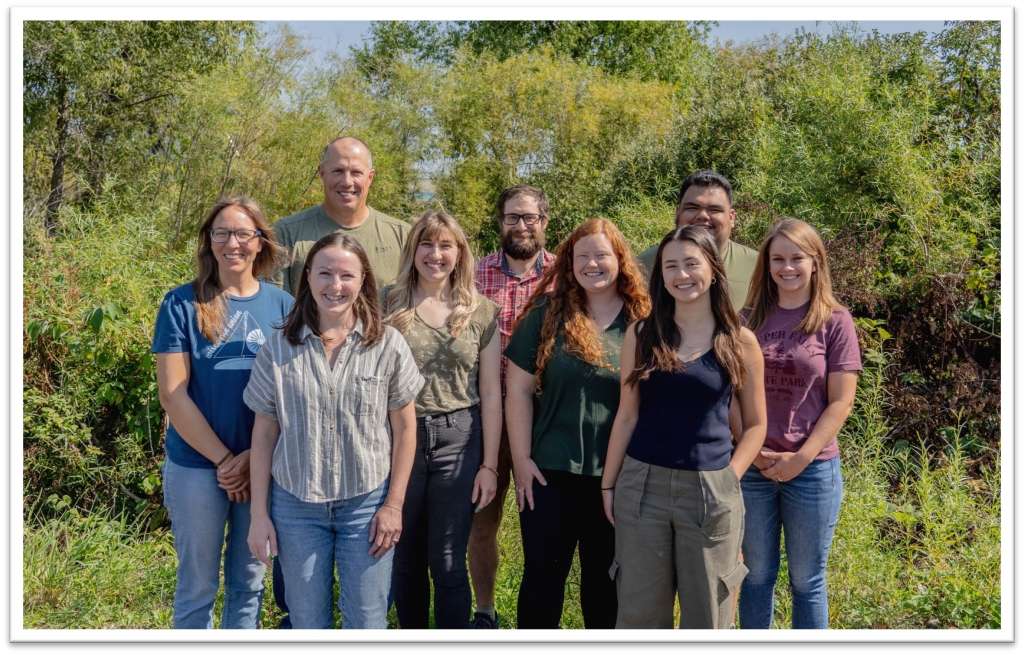 The Snapshot Wisconsin team in a group photo on a sunny summer day.