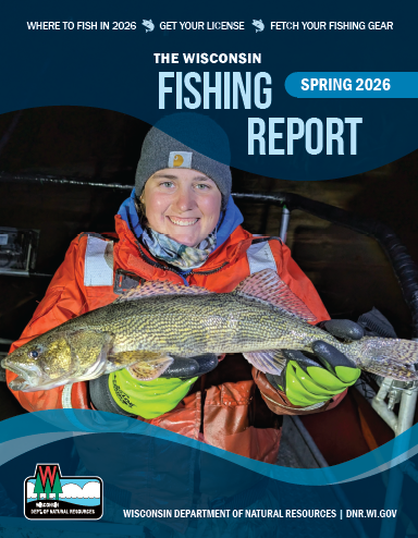 Technician holding a sauger collected at night from the Mississippi River.