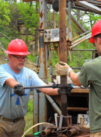 Pete Chase and Jacob Krause, WGNHS, install well casing during a GCC-funded experiment designed to improve understanding of virus transport from wastewater to drinking water wells