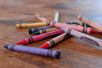 Close-up of a pile of crayons on a table