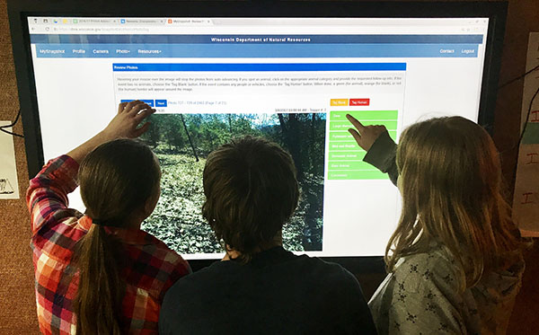 Elementary Students classifying photos online captured on a Snapshot Wisconsin Camera.